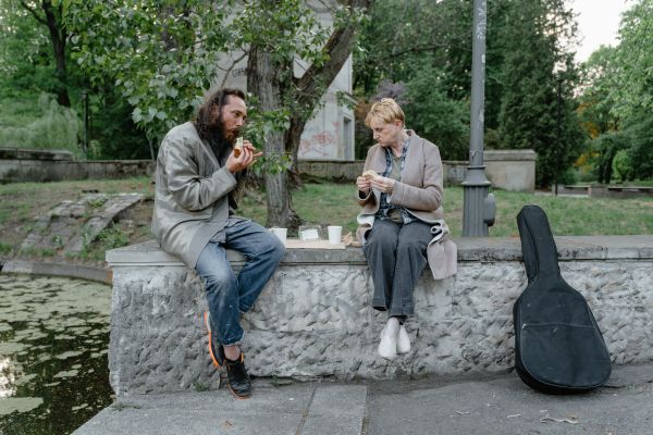Man and Woman Eating on the Street